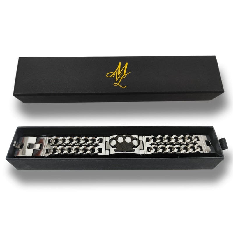Pulsera Mi Vida Loca MVL plata/negra con placa del logo MVL negra en la caja de regalo abierta