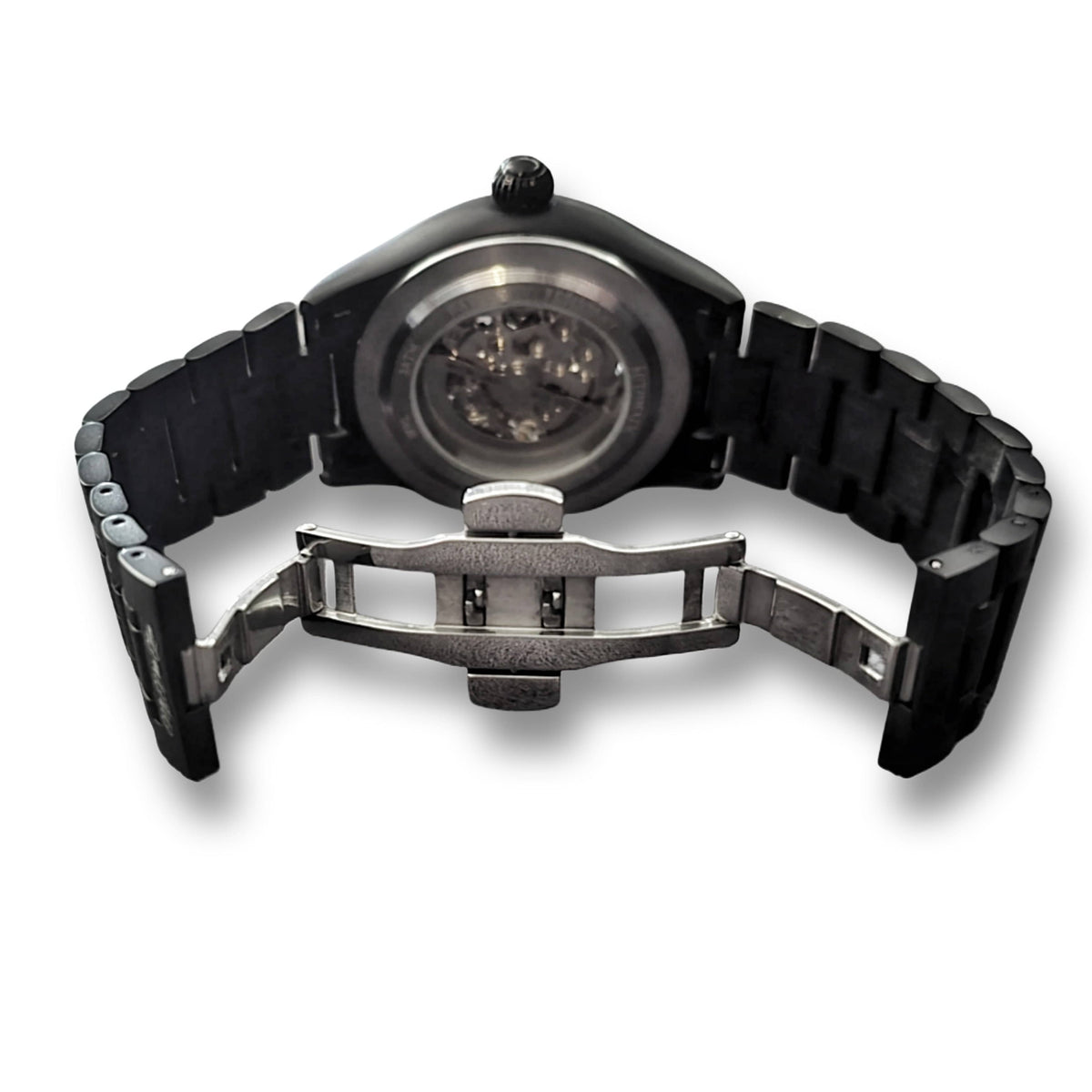 Back of the matte black MVL Double skull watch with the folding clasp of the link bracelet open