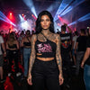 Mi Vida Loca Babe Skull one-shoulder top in black with pink print, worn by model at a party